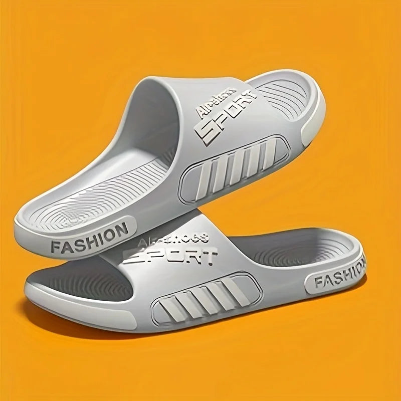 Step into comfort with these men’s lightweight sport slides, designed for everyday versatility. Featuring an anti-slip sole and a comfortable fit, these durable slippers are perfect for relaxing at home, strolling along the